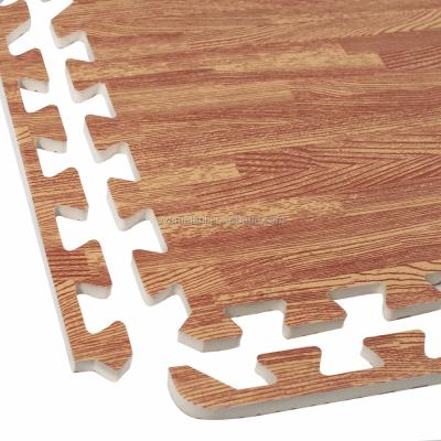 China Puzzle Wood Grain Serving Floor Set Interlocking Anti-fatigue EVA Foam Mat (With Borders) for sale