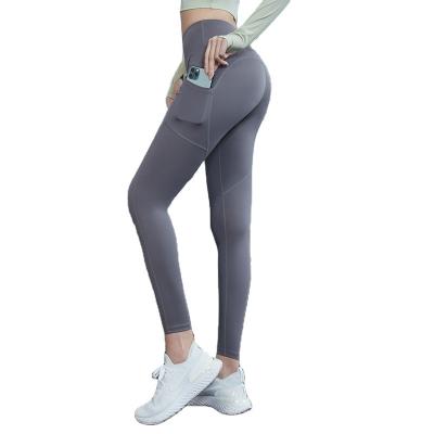 China Breathable Stretch Pocket Yoga High Running Yoga Pants Tight Waist Pants for sale