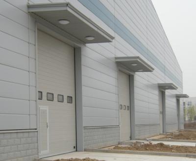 China Modern industrial sectional doors and industrial sectional doors hardwares and PU foam sectional sandwich panels for sale