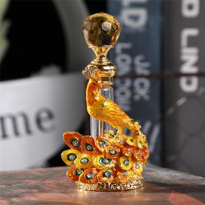 China Europe March 2022 EXPO 2022 Color Peacock Perfume Bottle Top Exquisite Diamond Embossed Luxury Perfume Bottle 4ml for sale