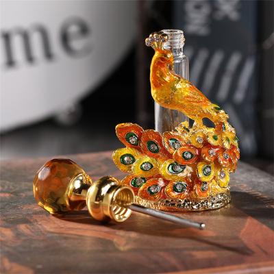 China 2022 EXPO Europe March Dubai Essential Oil Tube Top Bottle Exquisite Peacock Color Diamond Embossed 4ml Peacock Perfume Bottle for sale