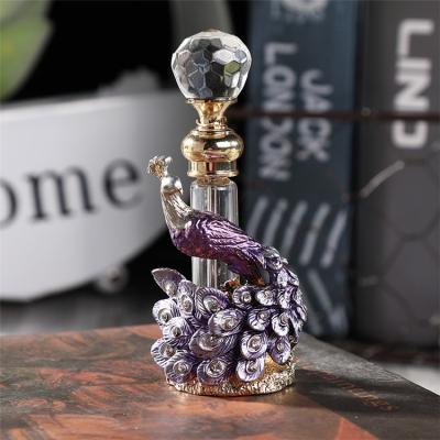 China 2022 EXPO Europe March Dubai Essential Oil Tube Top Bottle Exquisite Peacock Color Diamond Embossed 4ml Peacock Perfume Bottle for sale