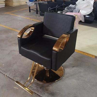 China New Modern Design Gold Round Base Armrest Black Metal Salon Chair Leather Barber Chair Hairdressing Furniture for sale