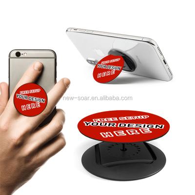 China Plastic Factory Out Promotional Gift Increasing Universal Nuckees Stand Grip Tablet Phone Holder Up Small Mobile Spell With Logo Custom for sale