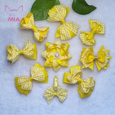 China Fashionable Children's Plaid Yellow Cute Bow Ribbon Hair Clips Summer Cool Hair Clips For Girls for sale