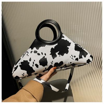 China Hot Selling Fashion Plaid Cow Pattern Triangle Bag Fashion Catwalk One-Shoulder Messenger Bag for sale