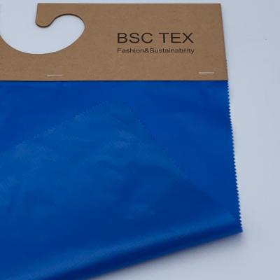 China 30D 0.25 Ripstop Recycled Polyester Fabric Coated Polyester Taffeta Fiber Proof for sale