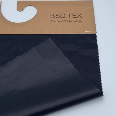 China 57gsm Semi Dull Recycled Nylon Fiber Ripstop 360T Waterproof Nylon Taffeta for sale