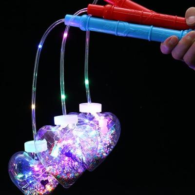 China 2022 Lovely Hot Sale Cartoon Colorful Hand Light Toy Transparent Instant Hand Lantern For Night Party Supplies for sale