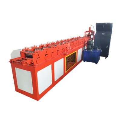 China Building Material Shops Steel And Aluminum Roller Shutter Door Roll Forming Machine With Stamping Flower for sale