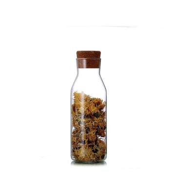 China Cheap and high quality viable 1000ml glass water bottle with wooden lid for sale