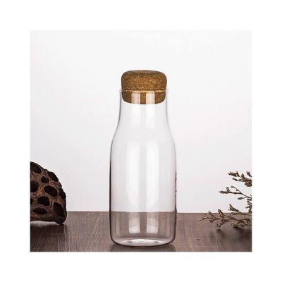 China Stored Most Popular Small Empty Glass Storage Bottle With Lid For Food for sale