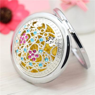 China Custom Lighted Logo Mirror Gemstones Mini Pocket Compact Portable Travel Make Up Flower Shapes Silver Round Folding Makeup Mirror for sale