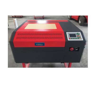 China Laser Engraving High Speed ​​Wood Glass Engraving And CO2 CNC Laser Cutting Machine for sale