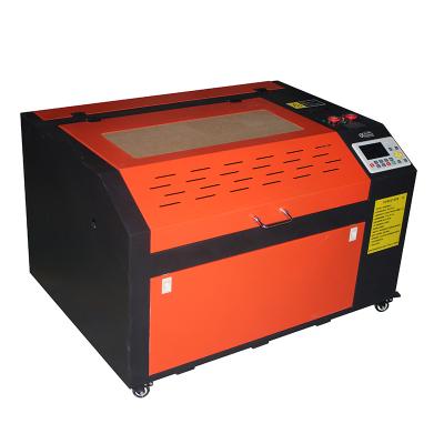 China Laser Engraving Most Popular CNC Router 600*900mm 100w Laser Engraving Cutting Machines / CO2 Laser Engraving Machine for sale