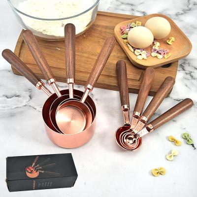 China Viable Custom Rose Gold 8pcs Set Stainless Steel Kitchen Tools Walnut Handle Measuring Cups Baking Measuring Cups for sale