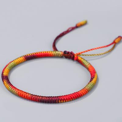 China Adjustable Braided Rope Lucky Bracelet Ethnic Handmade Tibetan Buddhist Fortune Knots Gradient Color Bracelet for sale