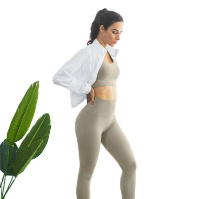 China Breathable New outerwear fitness suit Women's nude long sleeve tracksuit tight training pants Yoga suit three pieces for sale