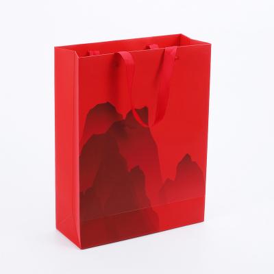 China Euro Ribbon Handle Boutique Shopping Recyclable Luxury Packaging Customized Printed Kraft Paper Gift Bags With Logo for sale