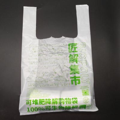 China BIODEGRADABLE custom environmental friendly plastic T-shirt fruit and vegetable bag carry 100% biodegradable shopping bags Te koop