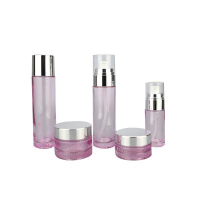 China New type cosmetic clear pink glass bottle and cosmetic jar 30g 50g 40ml 80ml 100ml 120ml container package for personal care production for sale