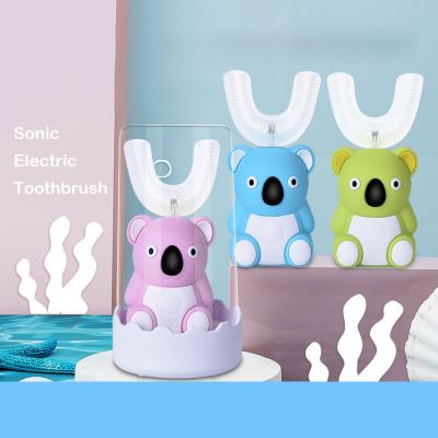 China Drop Shipping Battery Operated 360 U Shape Electric Toothbrush With Dock Charging Toothbrush For Kids Electric Toothbrush For Kids for sale