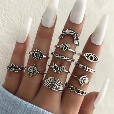 China High Quality 12 Pcs/Set Classic Fashion Sun Moon Coconut Tree Ring Ray Butterfly Glasses Flower Combination Ring Set Party Accessories for sale