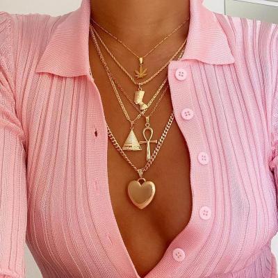 China High Quality 5 Pcs/Set Punk Female Necklace Leaves Heart Portrait Triangle Cross Pendant Multilayer Gold Necklace Bohemian Lady Accessories for sale