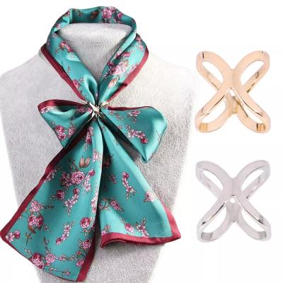 China Durable Simple Cross Scarf Clip X Shape Metal Brooches For Women Bow Scarves Buckle Holder Shawls Jewelry Accessories for sale