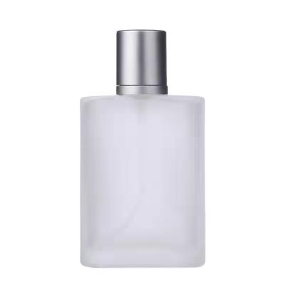 China 30ml 50ml Cosmetic Clear Glass Perfume Bottle With Silver Cap And Pump Sprayer Travel Glass Cosmetic Bottle for sale