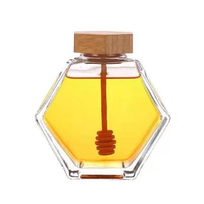 China Food Clear Hexagon Shape 220ml 380ml Glass Jar With Bamboo Lid For Holding Honey Storage Glass Bottle for sale