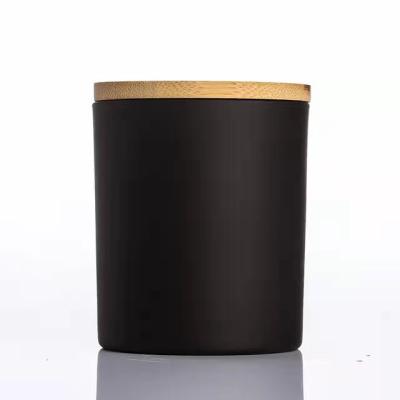 China Home Decoration D70mm*h84mm Cylinder Shape Wide Mouth Bottle Glass Candle Jar With Wooden Lid for sale