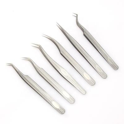 China Stainless Steel Popular Style Design Ergonomic Design Ribbon Tweezers Ergonomic Eyebrow Tweezers for sale