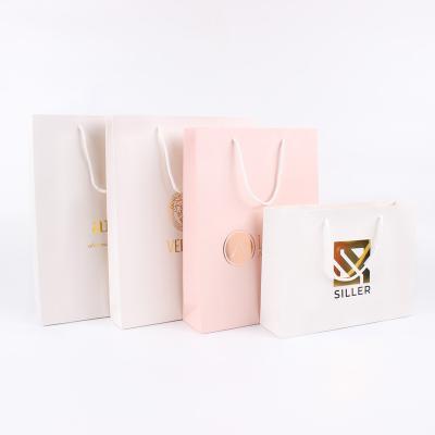 China Custom Recyclable and Biodegradable Economical Luxury Custom Jewelry Packaging Bag Logo Design Logo Gift Wrapping Paper Shopping Paper Bag with Ribbon Handles for sale