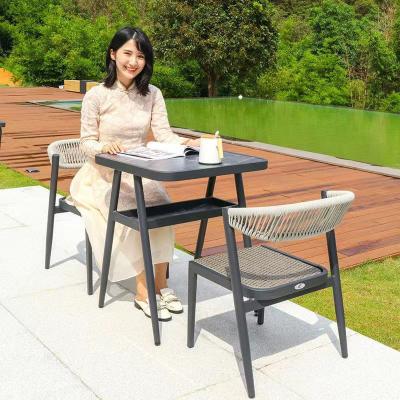 China Traditional Space Saving Plastic Rattan Chair And Table Perfect For Casual Garden Use for sale