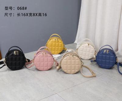 China Portable Original Design Small Round Shape Bags Women INS Texture Hot-selling Cross - Body Handbags Ladies Embossing Mini Handbags for sale