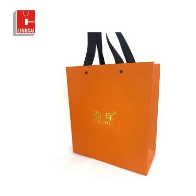 China Recyclable Cardboard White Paper Bag Custom Printed Logo Clothing Packaging Gift Carrier Bag Shopping Paper Bags Luxury for sale