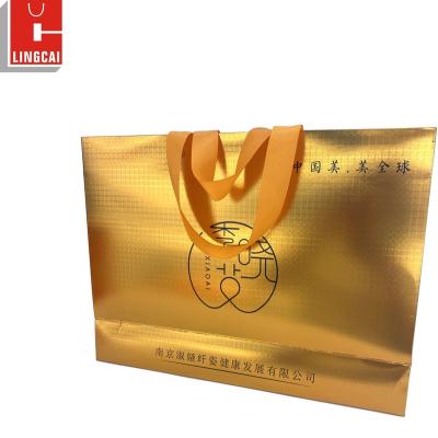 China Recyclable Luxury Custom Printed White Logo Gold Stamping Gift Paper Shopping Gift Bags With Handle for sale