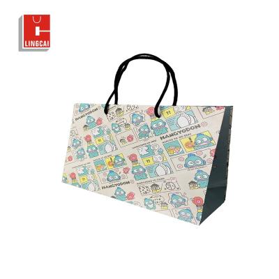 China Recyclable Custom Cartoon Bag Logo With Handle White Brown Kraft Gift Craft Shopping Paper Bag For Kids Clothing Holidays for sale