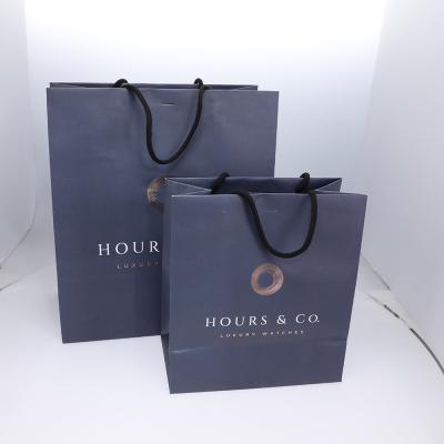 China Recyclable Custom Printed Black Kraft Paper Gift Packaging Bags for sale