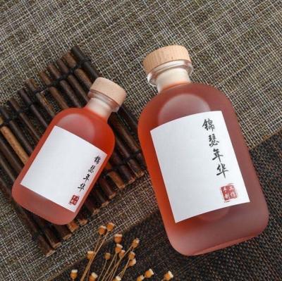 China In Stock 250ml 375ml 500ml frosted wine glass bottles Fresh Juice Drinking Bottles With Wooden Cork à venda