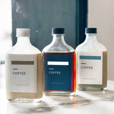 China 200ml Flat Flask Cold Brew Coffee Glass Bottle Milk Tea Glass Bottle Organic Fresh juice Glass Bottle with Metal Lid à venda