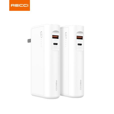 China Recci New Arrival Convenient PD 3.0 PD 20W Fast Charging 9600 mAh Output AC Dual Socket 2 in 1 Function Power Bank and Home Charger for sale