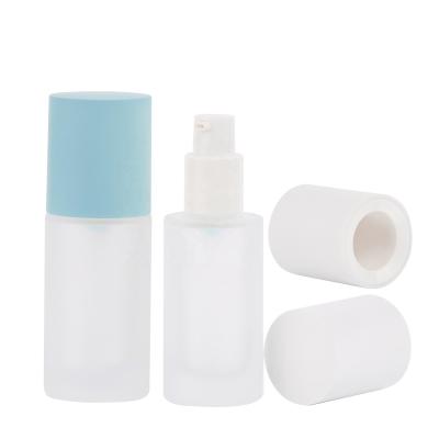 China Wholesale Cosmetic 30ml 40 Container 100 120ml Cosmetic Liquid Cylinder With Base Glass Pump Frosted Bottles for sale