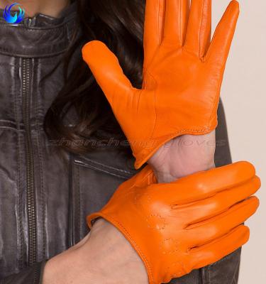 China New Style Cheap Girls Orange Short Unlined Sheepskin Leather Driving Contact Gloves for sale