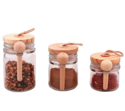 China Airtight Glass Jars With Lids And Spoons Storage Jar Wood Spice Wholesale Glass Jar for sale