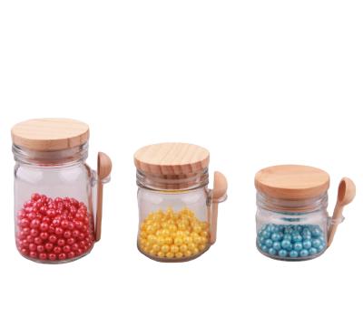 China Freshness Preservation Glass Spice Jar With Wooden Lid And Spoon Useful Candy Glass Jar for sale