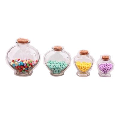 China Freshness Preservation Glass Heart Jars Storage Glass Jar And Canister With Cork Lid for sale