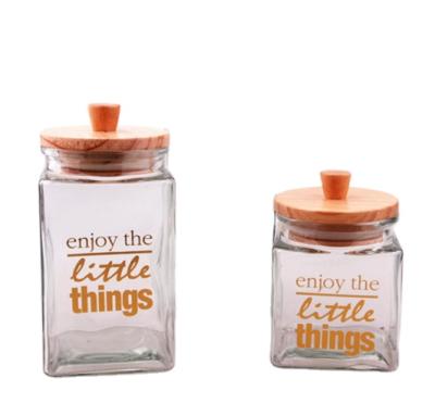 China Modern glass canister storage jars wooden lid glass food containers and decaled glass canister jars for sale