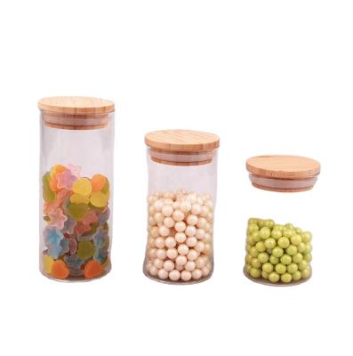 China High Quality Sustainable High Borosilicate Glass Candy Spice Food Storage Jar Container With Nature Wood Lid for sale